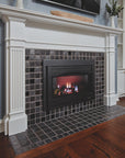 An angled view of a fireplace and hearth made up of charcoal and glossy black or "onyx" tiles. 