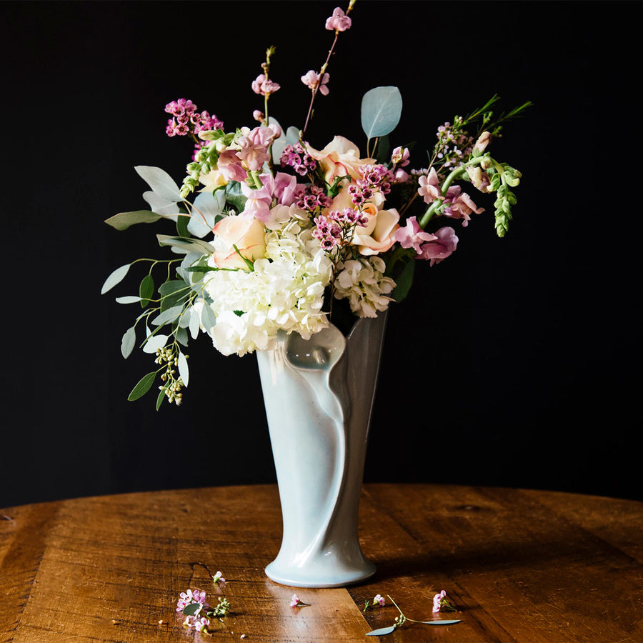 The glossy pale blue-gray color of the Frost glaze shines on this sleek Calla Lily vase.