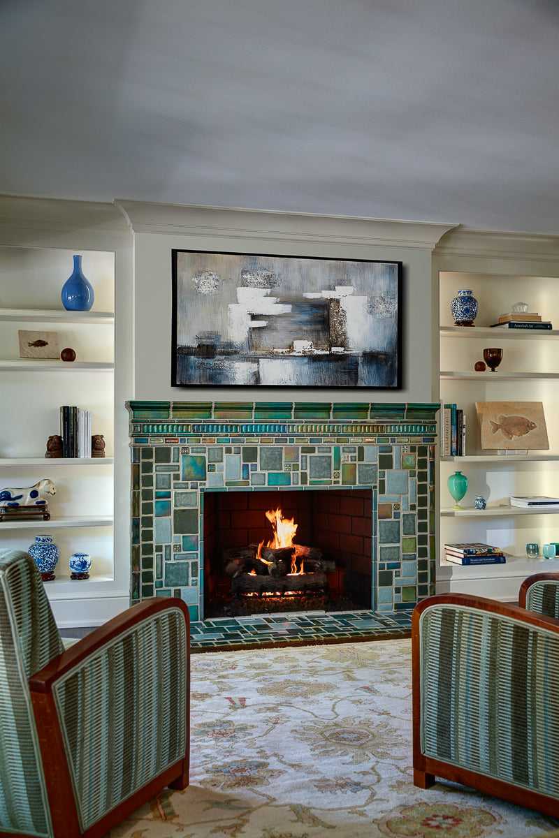 Vibrant, lit fireplace made up of Iridescent and matte glazes which creates an overall green, mirror-like effect. 
