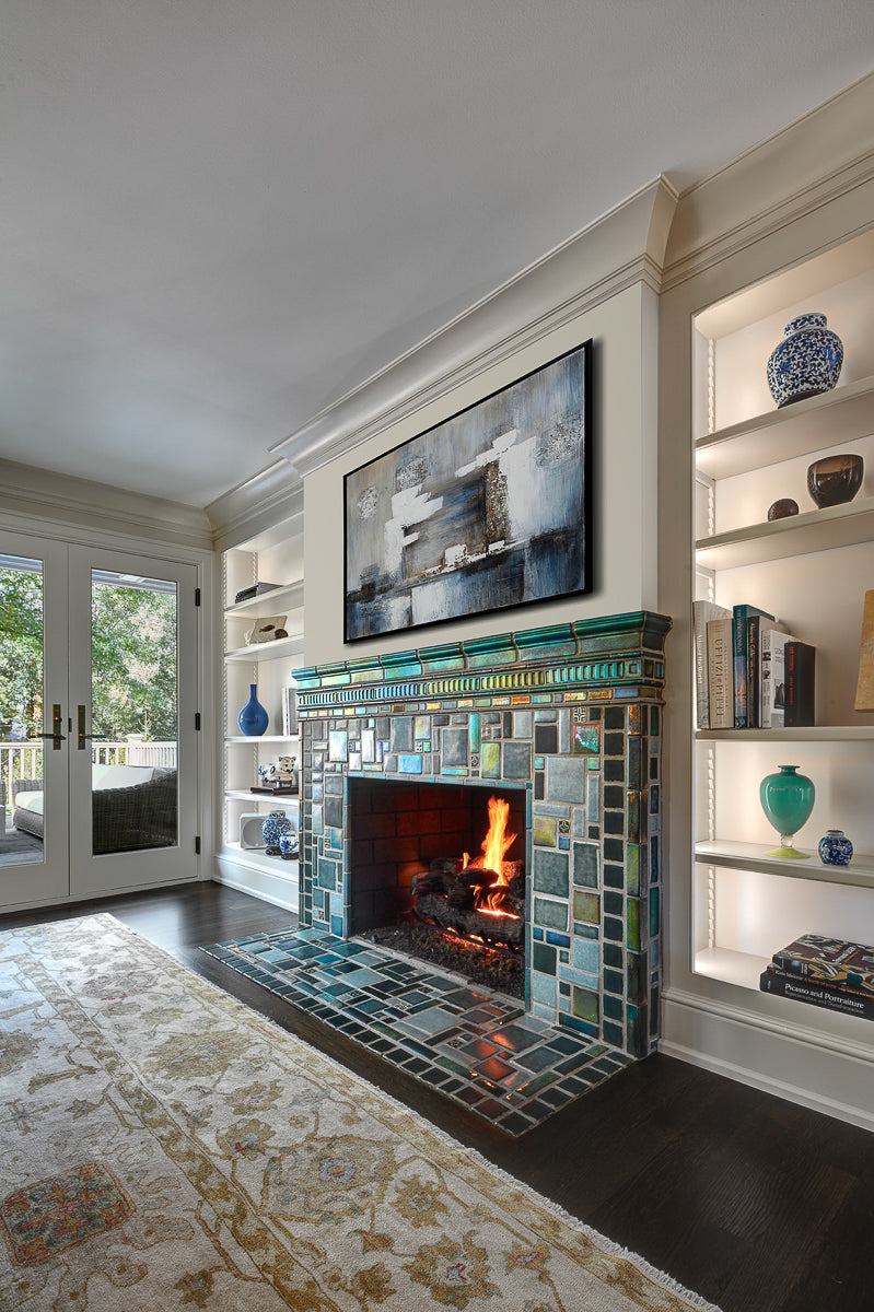 Vibrant, lit fireplace made up of Iridescent and matte glazes which creates an overall green, mirror-like effect. 