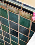 Details of the blue, green, and "Aurora" iridescent 4x4 field tiles and custom trim.