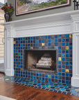 This fireplace features Iridescent tile accents along with a mix of complementary blue and charcoal tones. 