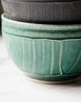 This bowls features the matte blueish-green Pewabic Green glaze.