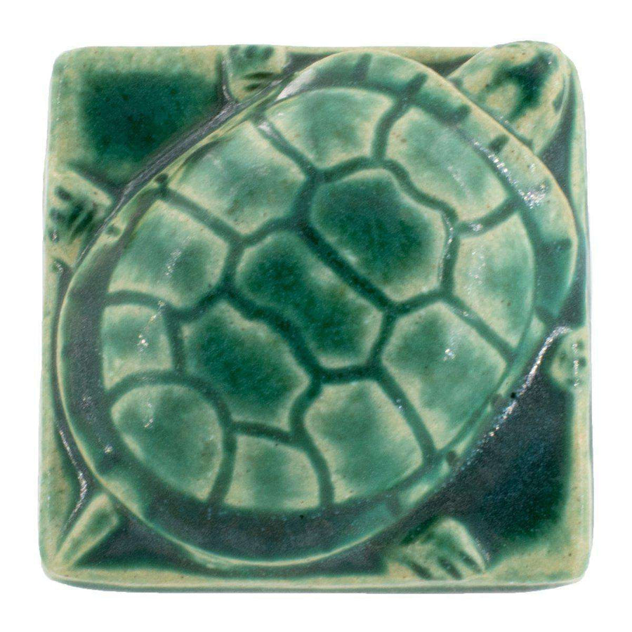 A turtle paperweight in Pewabic Green sits on a bright plain background.