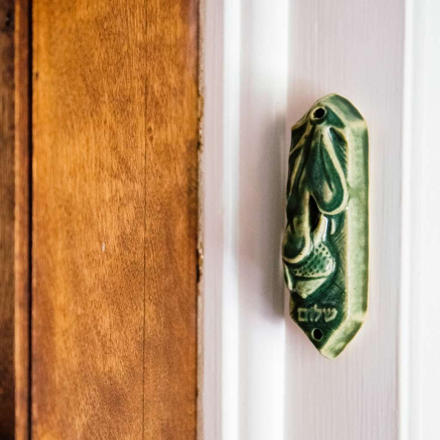 This Mezuzah features the matte organic green Leaf glaze.