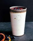 This Birch Pint holds a colorful smoothy with blueberries and slices of blood orange.
