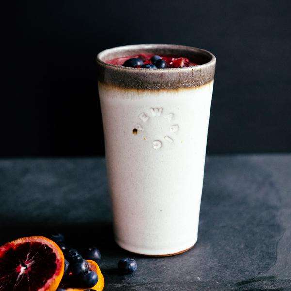 This Birch Pint holds a colorful smoothy with blueberries and slices of blood orange.