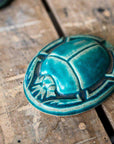 This paperweight features the matte turquoise Pewabic Blue glaze.