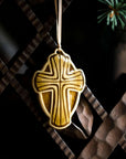 The Cross Ornament features a cross with a halo-like oval behind it. This ornament features the deep golden Honey Gloss glaze.
