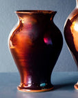 This copper vase has more pinks, reds and purples in its finish. This showcases the wide varieties in this glaze.