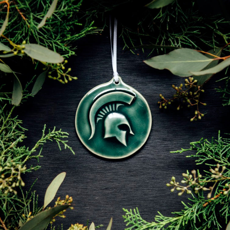 This ornament features the glossy deep green Kale glaze with a skinny white ribbon.