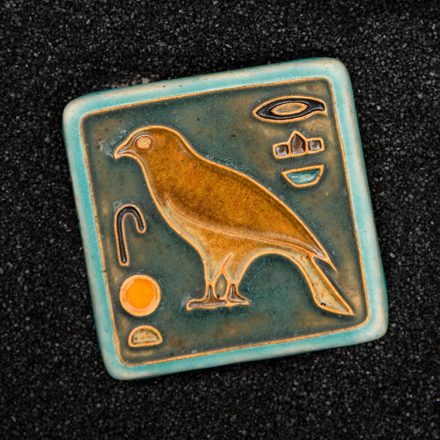 First designed in the 1920s, this hand-painted 3x3 tile depicts the bird hieroglyph Horus, the falcon-headed God of Light.