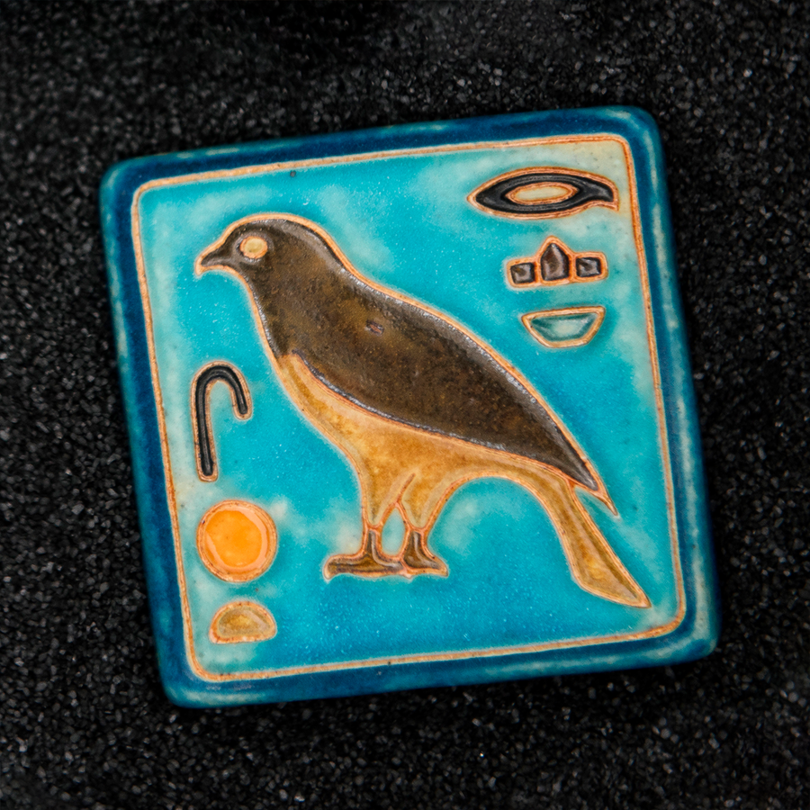 First designed in the 1920s, this hand-painted 3x3 tile depicts the bird hieroglyph Horus, the falcon-headed God of Light.
