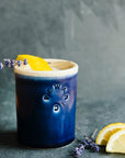 These cups feature the glossy deep dark blue Midnight glaze. The inner lining and lip of the cup have a creamy white color.