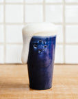 This pint features the glossy deep dark blue Midnight glaze with an off white inside and lip.