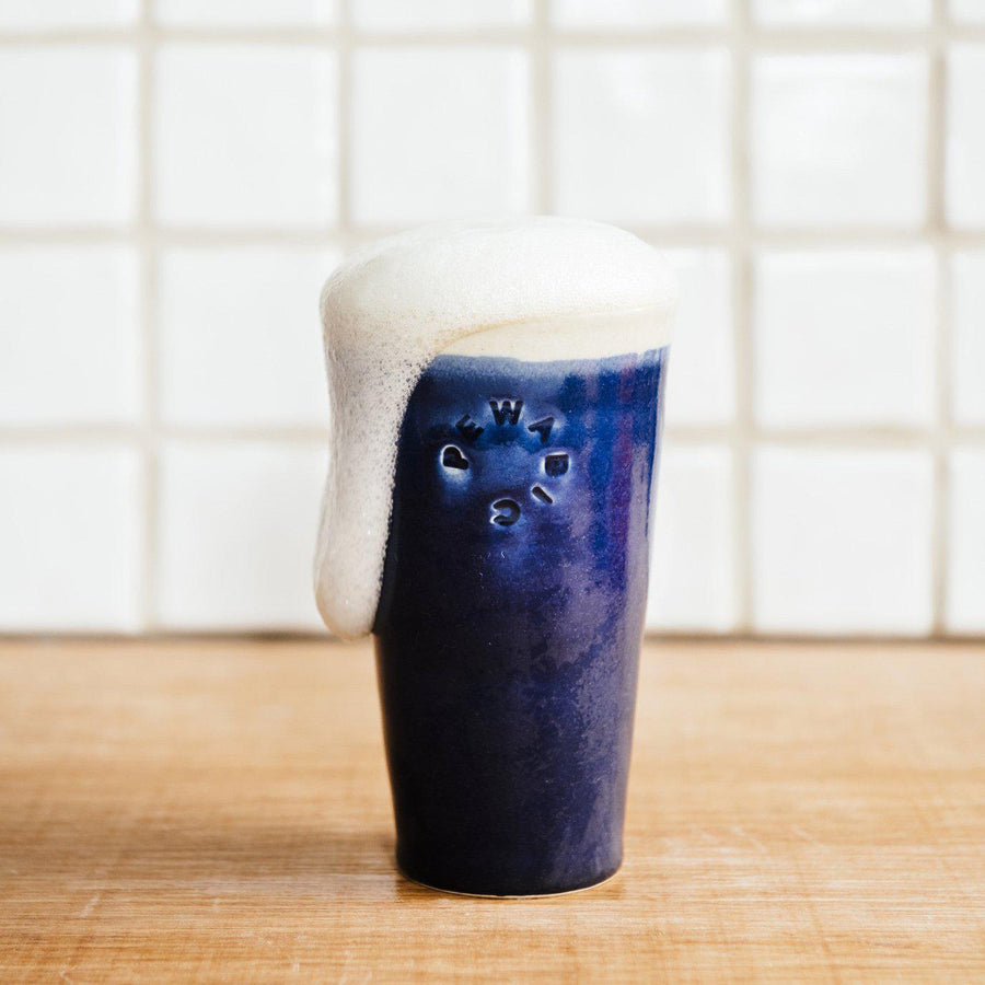 This pint features the glossy deep dark blue Midnight glaze with an off white inside and lip.