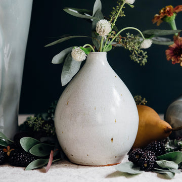 This vase features the creamy white Birch glaze that contains some sparse brown speckling.