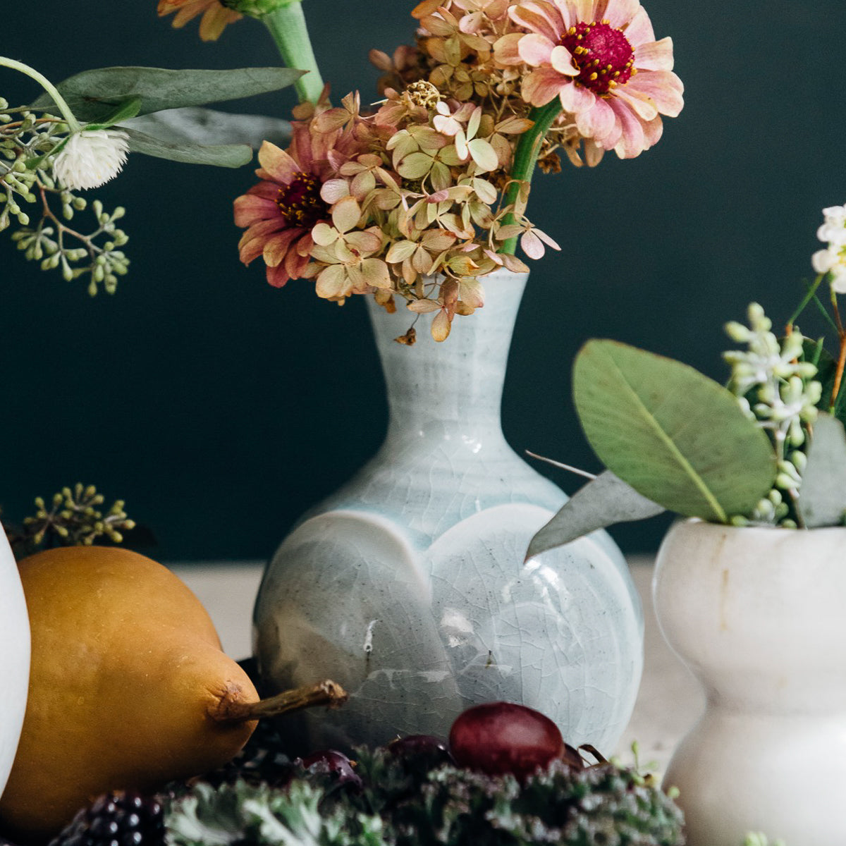 This Bud Vase features the glossy pale blue-gray Frost glaze.