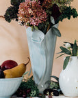 Ceramic Calla Lily Vase in a "Frost" alongside a Frost bowl and Teardrop Vase in Birch.