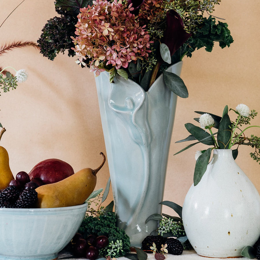 Ceramic Calla Lily Vase in a "Frost" alongside a Frost bowl and Teardrop Vase in Birch.