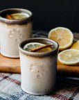 These Rocks cups feature the creamy white Birch glaze that has some brown speckling. The inner lining and lip of the cup have a mottled gray color.