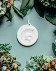 This ornament features the bright white matte Alabaster glaze with a skinny white ribbon..