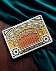 The Michigan Opera Theatre Postcard Tile design features the stage of the theatre with the curtains closed. The ornate pillars and ceiling are punctuated with blues and whites. Under the stage reads the words "Detroit Opera House" with two geometric floral designs on either side.