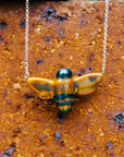 Up close, the bee's iridescent glaze is reflective, making the colors change depending on the lighting.