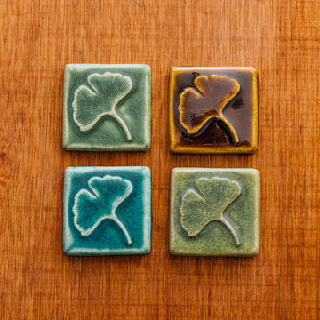 Four Ginkgo Tiles laid out in a square in four different glaze options.