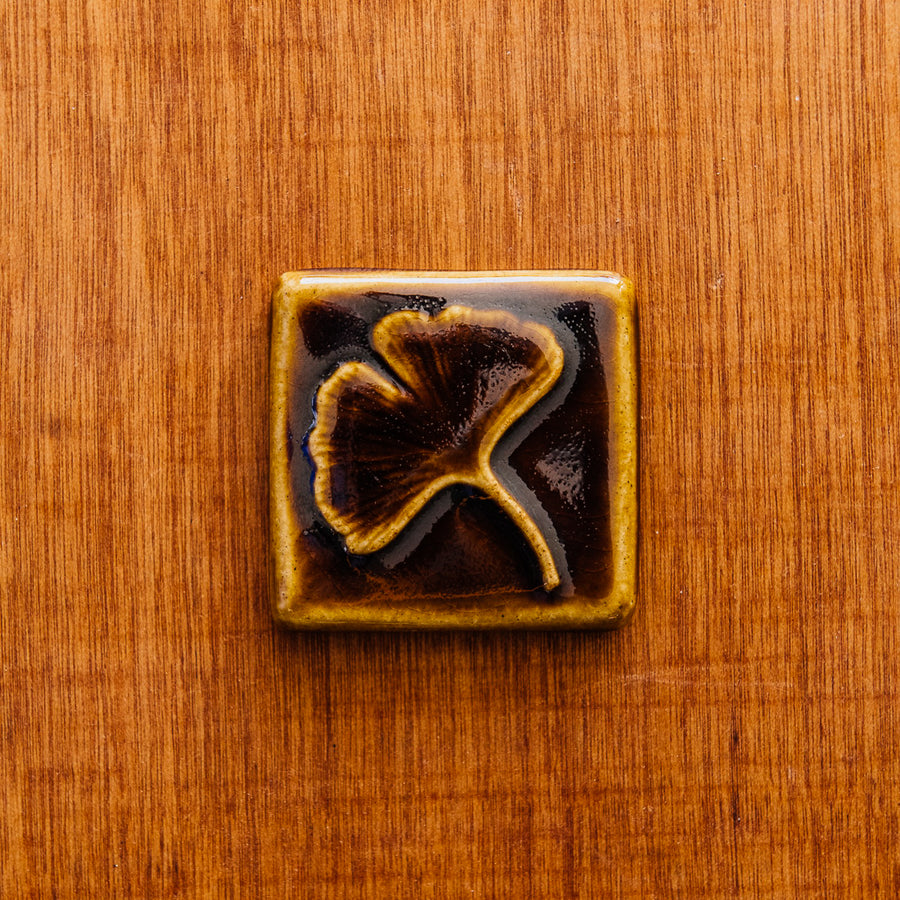 This Ginkgo Tile features the glossy earthy brown Molasses glaze.