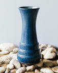 This vase features the matte deep Leland Blue with organic speckles of dark brown.