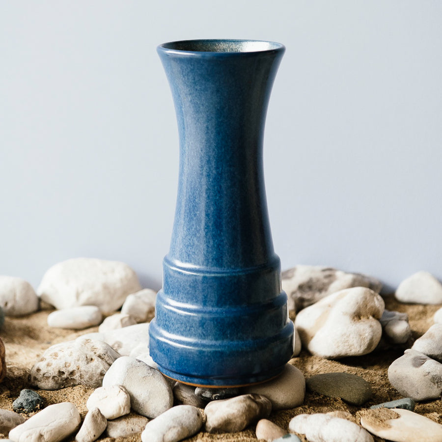 This vase features the matte deep Leland Blue with organic speckles of dark brown.