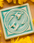 This Daffodil Tile features the glossy pale blue Celadon glaze.