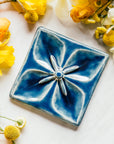This Geo Flower Tile features the glossy deep blue Ocean glaze.