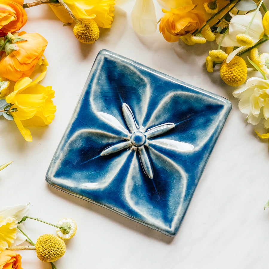 This Geo Flower Tile features the glossy deep blue Ocean glaze.