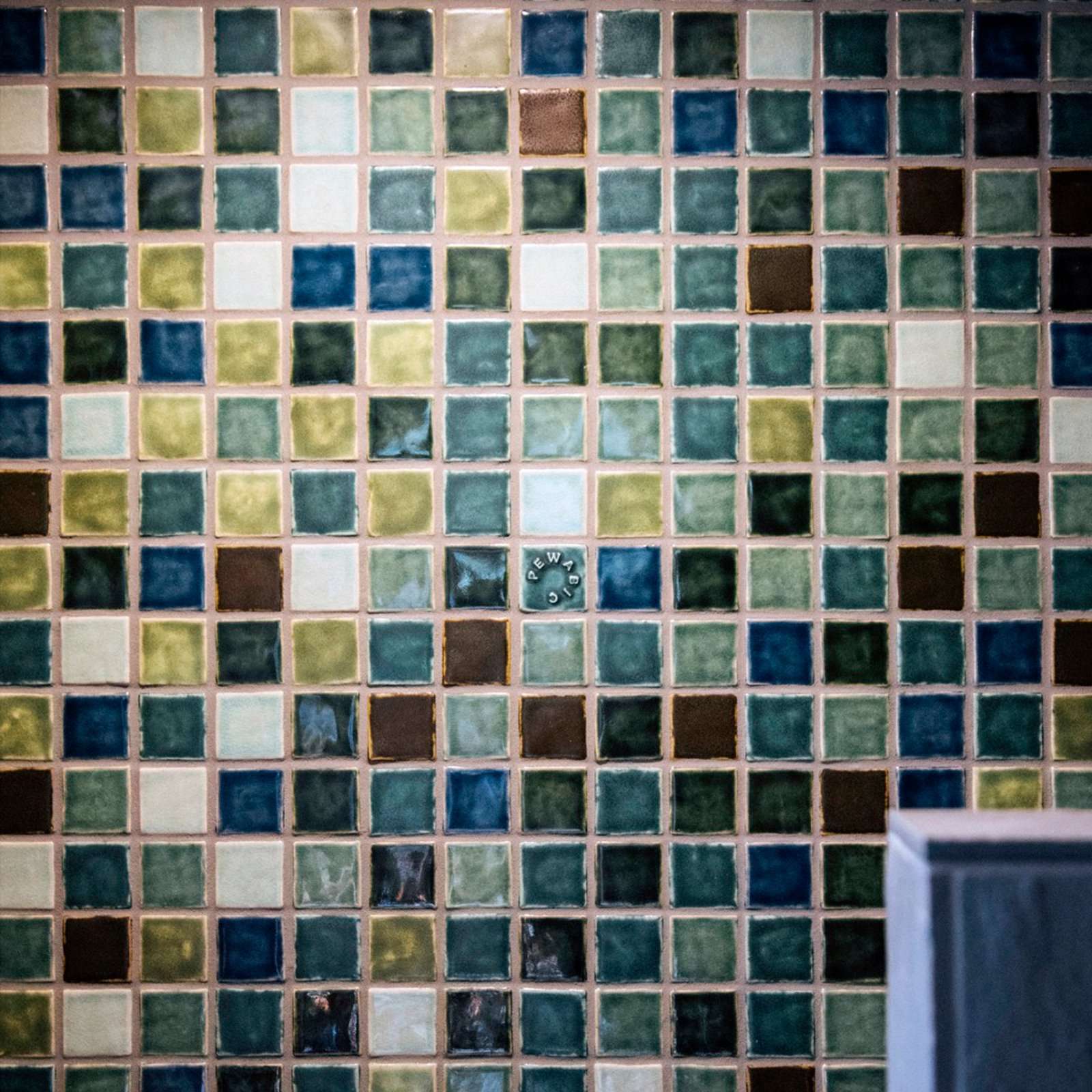 The colors of the tile make a random pattern.