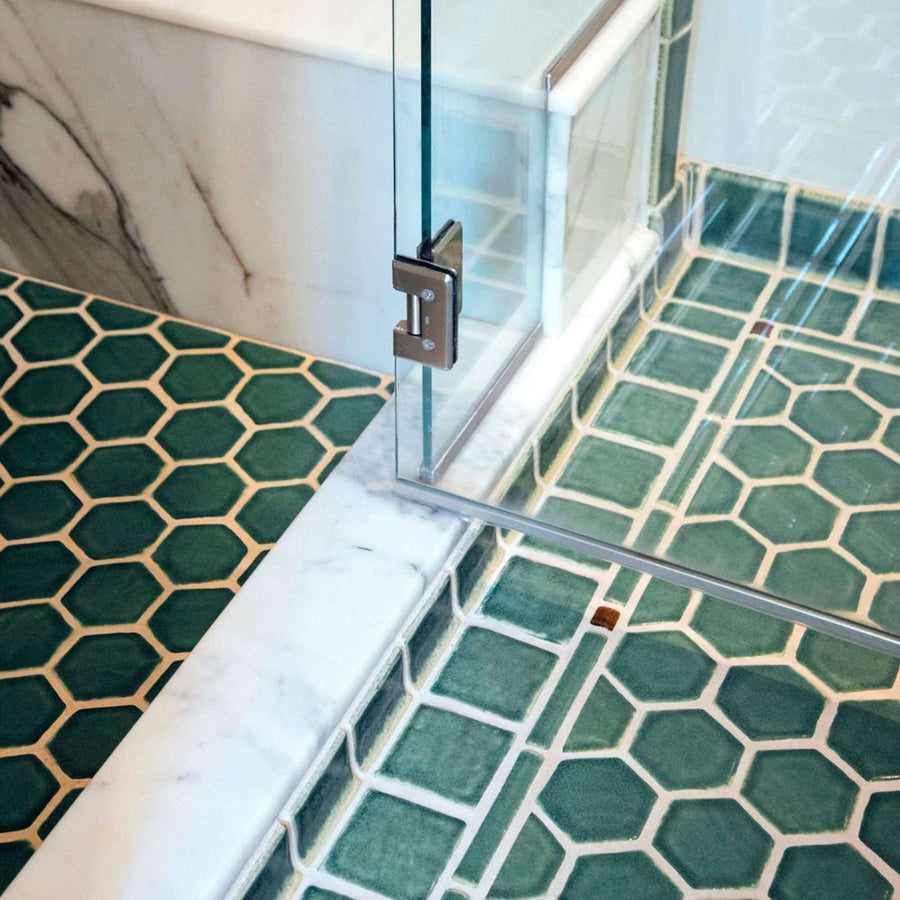 The shower floor also features the hexagonal shaped tiles.