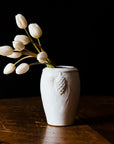 This vase features the creamy white Birch glaze that has some brown speckling from iron found in the glaze.