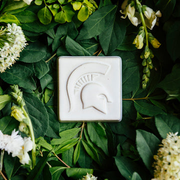 The Spartan Tile features a high relief design of a Spartan helmet with a large crest. 