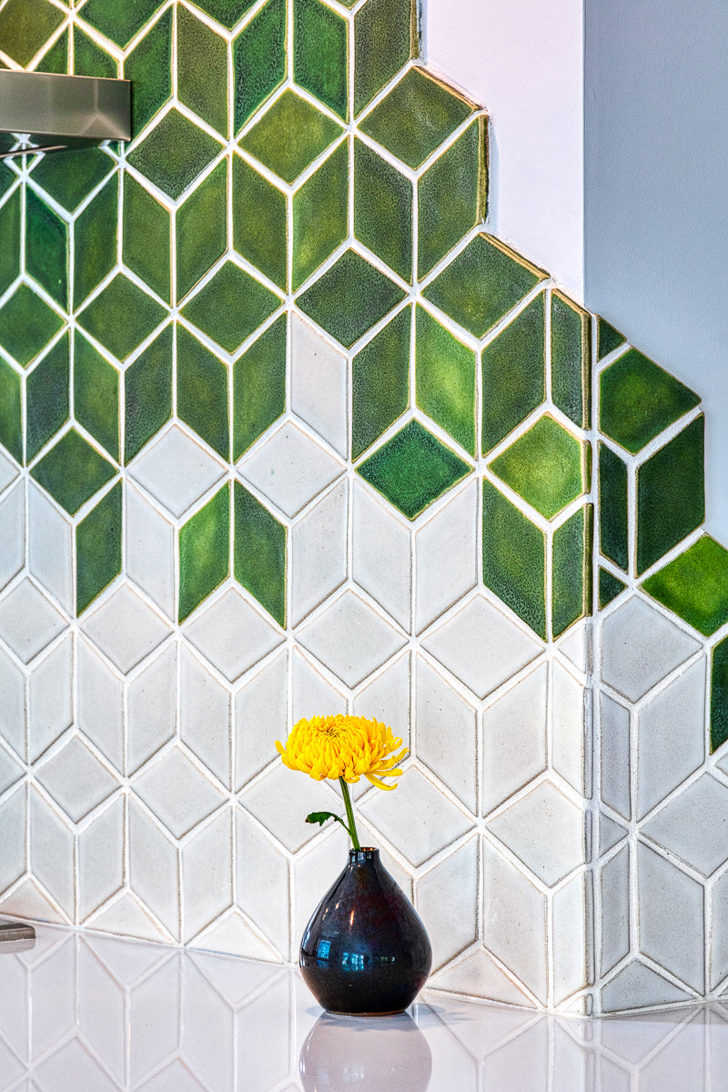 Detail shot of the Rhombus tile design and Bud Vase in Copper Iridescent. 
