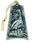 The ornament is glazed in a steel blue color with a pale green ribbon.