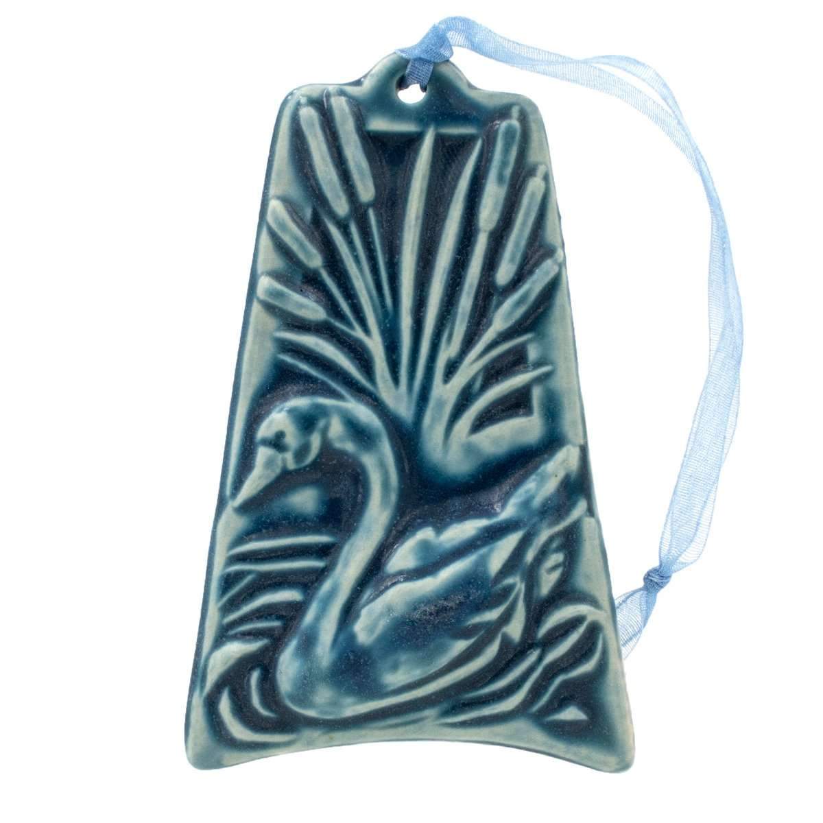 The ornament is glazed in a bright blue color with a pale blue ribbon to hang from.
