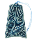The ornament is glazed in a bright blue color with a pale blue ribbon to hang from.