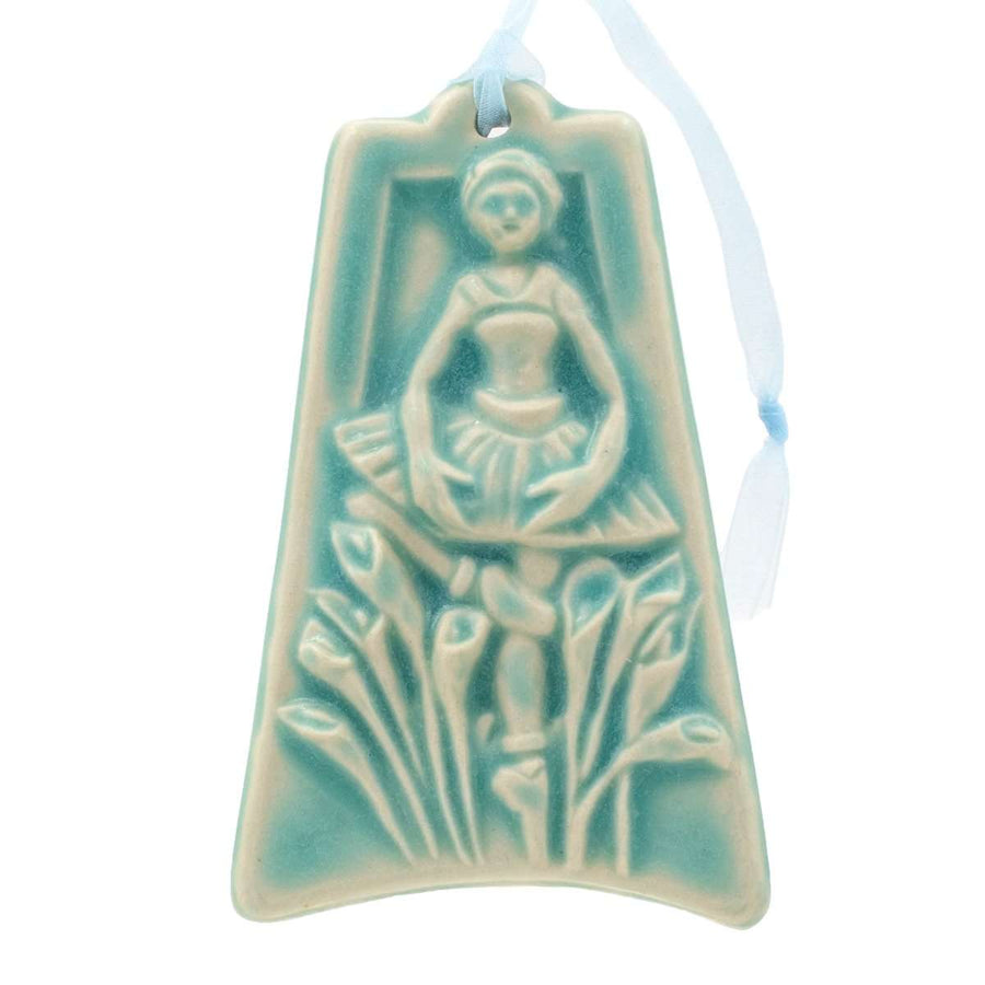 The ornament is glazed in a matte pale blue color.