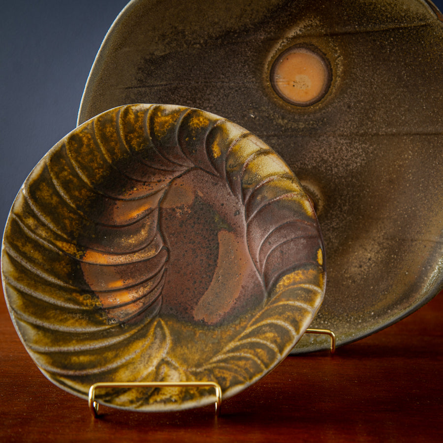 These Justin Lambert plates are autumn shades of brown and yellow.