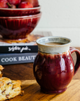 The Classic Mug is has rounded sides with a more narrow opening for drinking. The main body of the mug is the main glaze color while the inside and the lip are a coordinating color. This mug features the glossy deep red Winterberry glaze with a gray lip and interior.